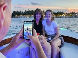 A group of people on a holiday boat tour taking a photo.