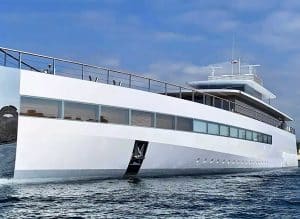 A modern white luxury yacht from Palm Beach Mega Yachts, with large windows, cruises on calm water under a partly cloudy sky.